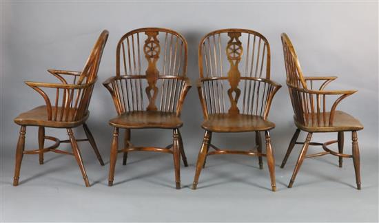 A near set of four 19th century yew, ash and elm Windsor chairs, W.1ft 11in. D.2ft H.3ft 4in.